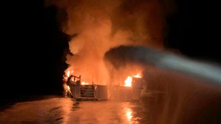 FILE – In this photo provided by the Ventura County Fire Department, VCFD firefighters respond to a fire aboard the Conception dive boat fire in the Santa Barbara Channel off the coast of Southern California on Sept. 2, 2019. On Friday, Sept. 2, 2022, a federal judge has thrown out an indictment charging a boat captain with manslaughter in the deaths of 34 scuba divers three years ago off the California coast  (Ventura County Fire Department via AP, File)