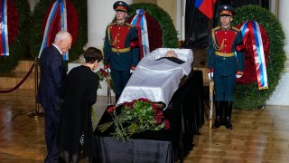 People stand by the coffin of former Soviet President Mikhail Gorbachev