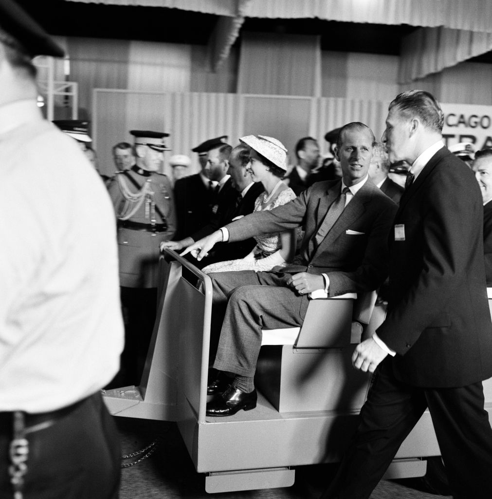 Queen Elizabeth II and Prince Philip, Duke of Edinburgh Royal tour of Canada and The United States. The Queen and Duke take a ride in an electric car to drive through the International Chicago Trade Fair. 6th July 1959. (Photo by Freddie Reed/Mirrorpix via Getty Images)