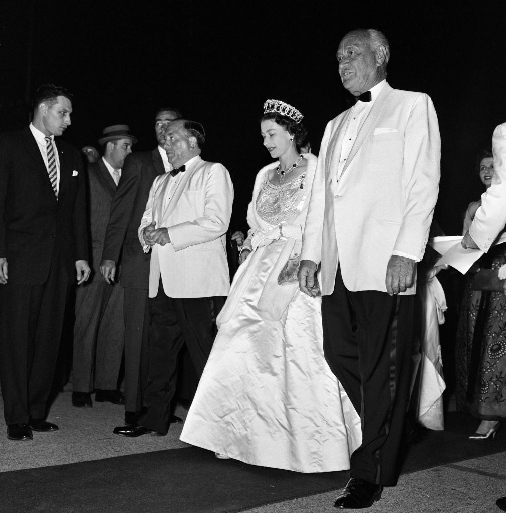 Queen Elizabeth II and Prince Philip, Duke of Edinburgh Royal tour of Canada and The United States. The Queen pictured with Conrad Hilton arriving for a dinner in Chicago. 6th July 1959. (Photo by Freddie Reed/Mirrorpix via Getty Images)