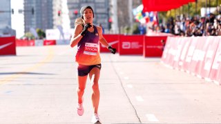 USA’s Emily Sisson crosses the finish line to place second in the women’s division of the 2022 Bank of America Chicago Marathon in Chicago, Illinois, on October 9, 2022. (Photo by KAMIL KRZACZYNSKI / AFP) (Photo by KAMIL KRZACZYNSKI/AFP via Getty Images)