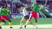 Diego Maradona of Argentina and Andre Kana-Biyik of Cameroon battle for the ball during the FIFA World Cup Italy Group B match between Argentina and Cameroon at Stadio Giuseppe Meazza on June 8, 1990 in Milan , Italy.