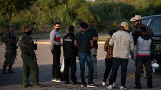 Migrants are detained by border patrol in Eagle Pass, Texas on November 8, 2022.