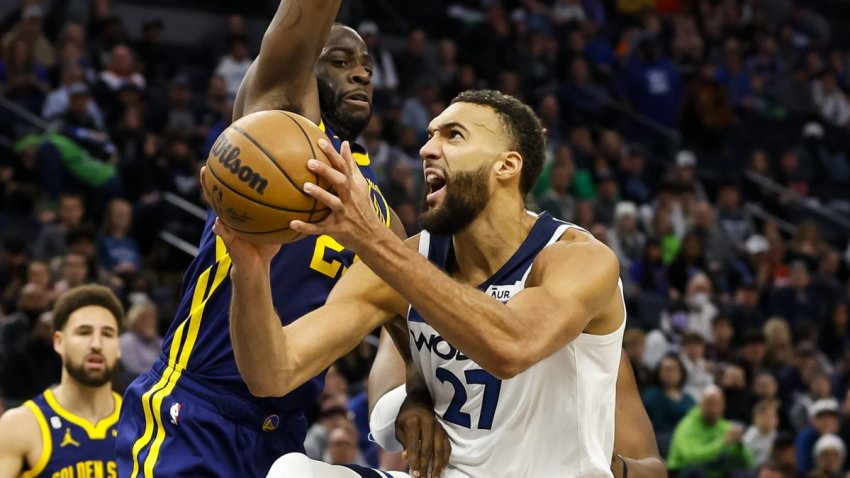 MINNEAPOLIS, MN – NOVEMBER 27: Rudy Gobert #27 of the Minnesota Timberwolves drives to the basket against Draymond Green #23 of the Golden State Warriors in the fourth quarter at Target Center on November 27, 2022 in Minneapolis, Minnesota. The Warriors defeated the Timberwolves 137-114. NOTE TO USER: User expressly acknowledges and agrees that, by downloading and or using this Photograph, user is consenting to the terms and conditions of the Getty Images License Agreement. (Photo by David Berding/Getty Images)