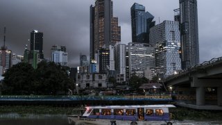 A boat ferries passengers on the Pasig River in Makati City, Metro Manila, the Philippines, on Monday, Aug. 15, 2022.