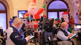 Traders work on the floor of the New York Stock Exchange during morning tradingon December 02, 2022 in New York City.