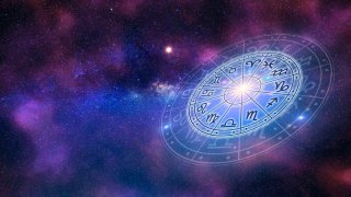 Zodiac signs inside of a horoscope circle