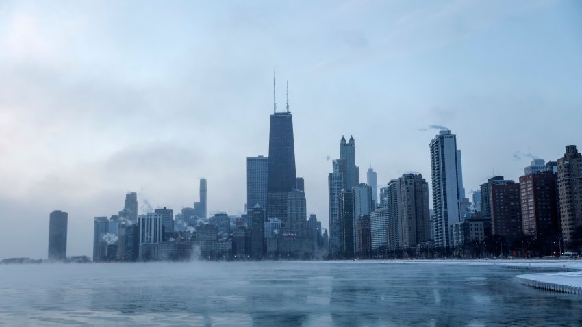 Mist rises from Chicago and Lake Michigan at sunrise on December 23, 2022, where temperatures reached -6F (-21C), ahead of the Christmas Holiday. – A “once-in-a-generation” winter storm with temperatures as low as -40F (-40C) caused Christmas travel chaos in the US on December 22, 2022, with thousands of flights cancelled and major highways closed. (Photo by KAMIL KRZACZYNSKI / AFP) (Photo by KAMIL KRZACZYNSKI/AFP via Getty Images)