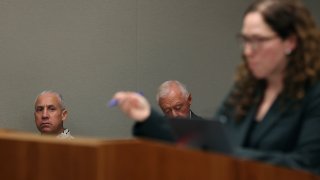 Albert “Ian” Schweitzer, left, looks on as Innocence Project attorney Susan Freidman speaks during Schweitzer’s court case Tuesday, Jan. 24, 2023, in Hilo, Hawaii.