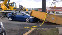 Denny's Sign Falls on Car