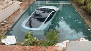 Two adults and a 4-year-old child were rescued from a Tesla that crashed into a pool Tuesday Jan. 10, 2023 in Pasadena.