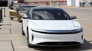 People test drive Dream Edition P and Dream Edition R electric vehicles at the Lucid Motors plant in Casa Grande, Arizona, September 28, 2021.