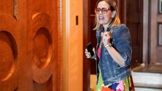 U.S. Senator Kyrsten Sinema (D-AZ) walks out from the floor for a moment during voting for the “Inflation Reduction Act of 2022,” at the U.S. Capitol building in Washington, D.C., U.S., August 7, 2022.