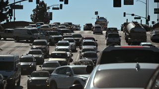 Cars jam an intersection in the San Fernando Valley of Los Angeles, California, on August 22, 2022.