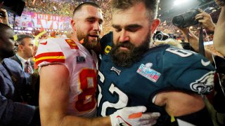 Kansas City Chiefs’ Travis Kelce with his brother, Philadelphia Eagles’ Jason Kelce as the Kansas City Chiefs celebrate after winning Super Bowl LVII.