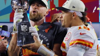 Kansas City Chiefs’ Travis Kelce and Patrick Mahomes celebrate with the Vince Lombardi Trophy after winning Super Bowl LVII.