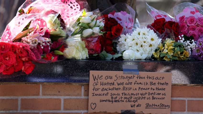 EAST LANSING, MICHIGAN – FEBRUARY 14: A message is taped to the base of the Spartan statue on the campus Michigan State University on February 14, 2023 in East Lansing, Michigan. A gunman opened fire at two locations on the campus last night killing three students and injuring several others. (Photo by Scott Olson/Getty Images)