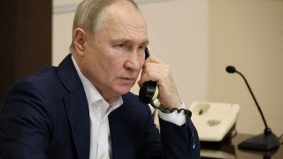 Russia’s President Vladimir Putin speaks on the phone during a conversation with Agatha Bylkova from the Kurgan region, an 8-year-old participant of a New Year’s and Christmas charity event, in Moscow, Russia, January 3, 2023. 