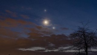 The moon, Jupiter and Venus light up the night sky.