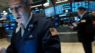 Traders work on the floor of the New York Stock Exchange (NYSE) on March 28, 2023 in New York City.