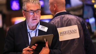 Traders work on the floor of the New York Stock Exchange during morning trading on April 10, 2023 in New York City.