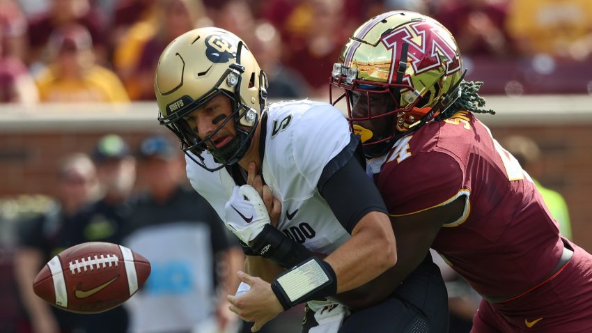 Sep 17, 2022; Minneapolis, Minnesota, USA; Minnesota Golden Gophers defensive back Terell Smith (4) tackles Colorado Buffaloes quarterback J.T. Shrout (5) for a fumble during the first quarter at Huntington Bank Stadium. Mandatory Credit: Matt Krohn-USA TODAY Sports