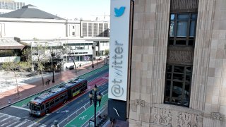 In an aerial view, a modified company sign is posted on the exterior of the Twitter headquarters in San Francisco, April 10, 2023.