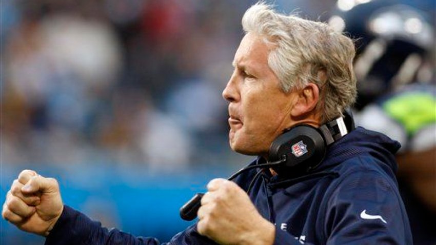 Seattle Seahawks head coach Pete Carroll reacts after a Seahawks touchdown against the Carolina Panthers during the third quarter of an NFL football game in Charlotte, N.C., Sunday, Oct. 7, 2012. (AP Photo/Nell Redmond)