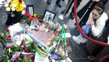 HOLLYWOOD, CA - DECEMBER 31: Actress Mandy Amano pays her respects at Carrie Fisher's makeshift Star on the Hollywood Walk Of Fame during "A Fan Tribute To Our Beloved Princess Leia" held in the Courtyard at TCL Chinese Theatre on December 31, 2016 in Hollywood, California.  (Photo by Albert L. Ortega/Getty Images)