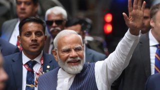 Indian Prime Minister Narendra Modi waves to supporters as he arrives at the Lotte New York Palace hotel in New York City, June 20, 2023.