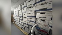 Stacks of boxes seen in the Mar-a-Lago ground floor storage room. According to the indictment, a second location had more boxes of documents in Pine Hall, an entry room in Trump's resident.