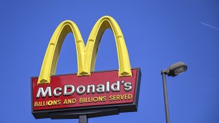 WASHINGTON, UNITED STATES – APRIL 03: Logo of the American fast food company McDonald’s is seen outside one of the stores in Washington, United States on April 03, 2023. McDonaldâs reportedly temporarily shuts its U.S. corporate offices ahead of layoffs. (Photo by Celal Gunes/Anadolu Agency via Getty Images)