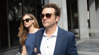 Actor Danny Masterson arrives at Clara Shortridge Foltz Criminal Justice Center in Los Angeles, CA on Wednesday, May 31, 2023 with wife Bijou Phillips.