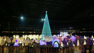 Guests explore Enchant Christmas, a traveling holiday light maze and market, which has taken over T-Mobile Park for the second year in a row, Thursday, December 5, 2019.  (Genna Martin, Seattlepi.com) (Photo by Genna Martin/San Francisco Chronicle via Getty Images)