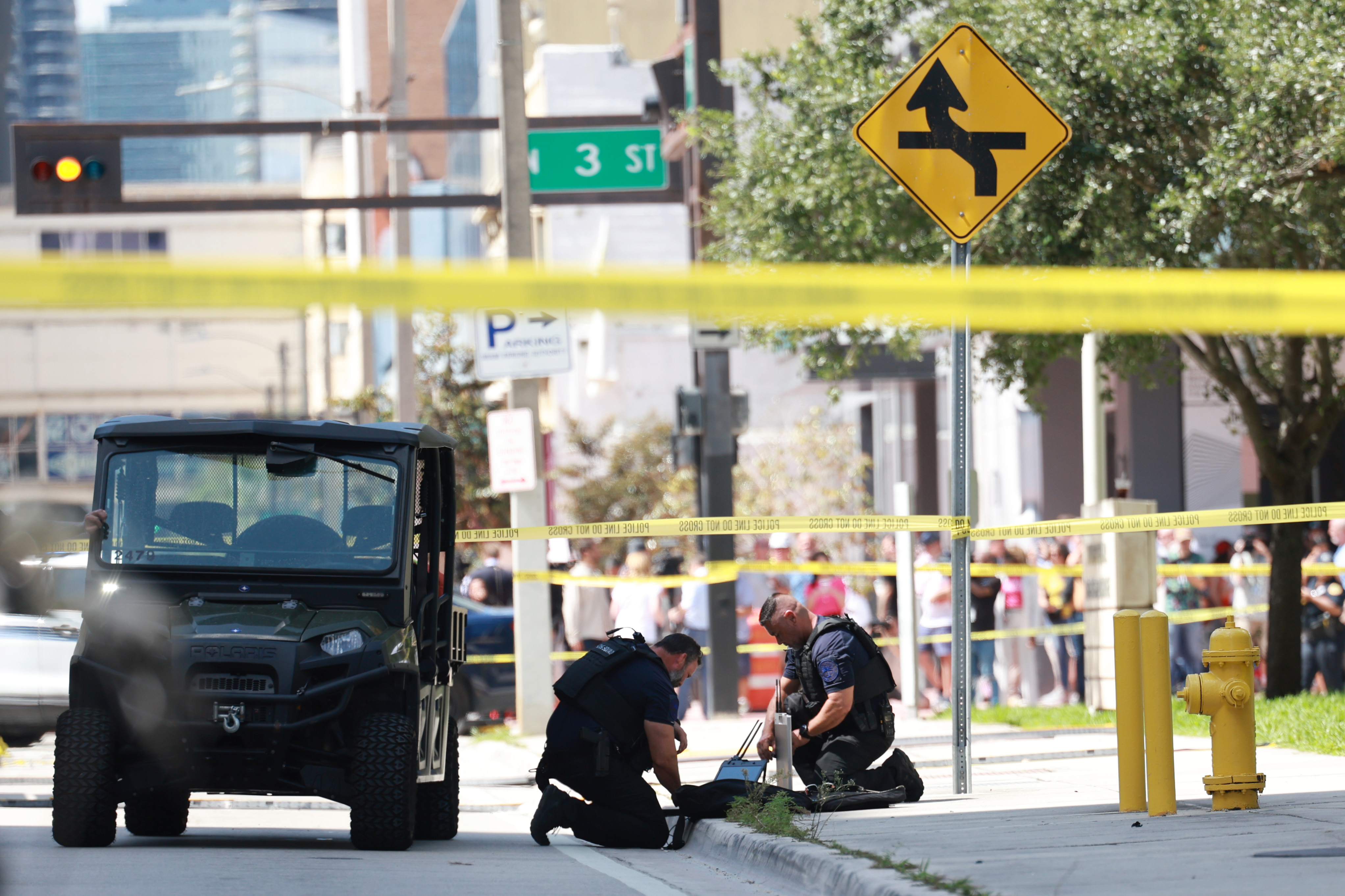 Miami police officers investigate a suspicious item near the media area outside the Wilkie D. Ferguson Jr. United States Federal Courthouse where former President Donald Trump is scheduled to be arraigned later in the day on June 13, 2023 in Miami.