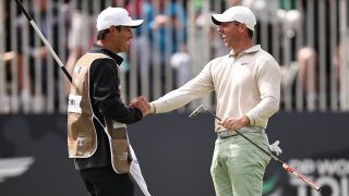 Rory McIlroy of Northern Ireland celebrates with his caddie Harry Diamond after putting in to win the tournament on the 18th green during Day Four of the Genesis Scottish Open at The Renaissance Club on July 16, 2023 in United Kingdom.