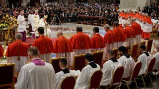 Pope Francis prays in front of new Cardinals