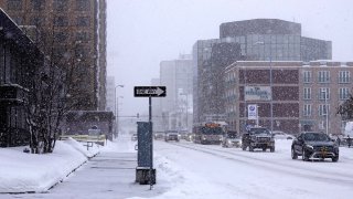 File- Snow falls in Anchorage, Alaska, on March 15, 2021.