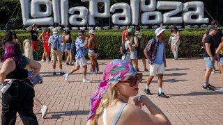 Attendees walk past a Lollapalooza sign during the first day of Lollapalooza in Grant Park on July 29, 2021, in Chicago. (Armando L. Sanchez/Chicago Tribune/Tribune News Service via Getty Images)