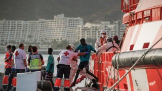 TOPSHOT – Migrants disembark from a Spanish Maritime Rescue vessel in the Port of Arguineguin on the Canary Island of Gran Canaria, on July 10, 2023. Spain’s coastguard said it had rescued 78 migrants from sub-Saharan Africa from a boat off the Canary Islands. (Photo by DESIREE MARTIN/AFP via Getty Images)