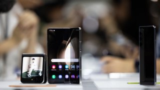 A Samsung Electronics Co. Galaxy Z Fold 5 smartphone, center, a Galaxy Z Flip5 smartphone during the Galaxy Unpacked event in Seoul, South Korea, on Wednesday, July 26, 2023.