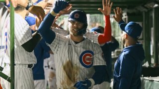 CHICAGO, ILLINOIS – JULY 19: Nico Hoerner #2 of the Chicago Cubs celebrates his grand slam in the eighth inning against the Washington Nationals at Wrigley Field on July 19, 2023 in Chicago, Illinois. (Photo by Quinn Harris/Getty Images)