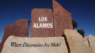 LOS ALAMOS, NM – FEBRUARY 27, 2016: A stone sign welcomes motorists to Los Alamos, New Mexico, home to the Los Alamos National Laboratory established in 1943 as part of the Manhattan Project, the nation’s top secret program to develop the atomic bomb. (Photo by Robert Alexander/Getty Images)