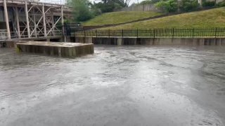 Locks on the Chicago River near suburban Wilmette are shown as water flows toward Lake Michigan.