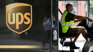 A UPS driver pulls away after making a delivery in Washington, D.C.