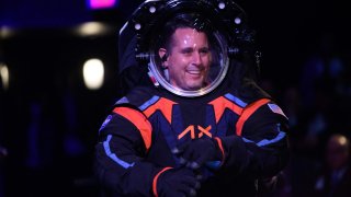 Chief Engineer Jim Stein wears the new spacesuit during the Axiom Space Artemis III Lunar Spacesuit event at Space Center Houston in Houston, Texas, on March 15, 2023. – “Since a spacesuit worn on the Moon must be white to reflect heat and protect astronauts from extreme high temperatures, a cover layer is currently being used for display purposes only to conceal the suits proprietary design, ” Axion said in a press release.