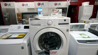 Washing machines are displayed at Sam’s Appliances TV & Furniture, on March 25, 2021, in Norwood, Mass.