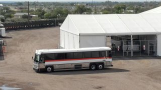 A bus carrying migrants departs from a U.S. Border Patrol processing facility in Eagle Pass, Texas, the United States, on Oct. 9, 2022. Buses carrying migrants from Republican-led border states continue to arrive in liberal bastions like New York, Washington, D.C., and Chicago, dragging the U.S. migrant crisis into the eye of the storm of partisan battles ahead of the November midterm elections. (Photo by Nick Wagner/Xinhua via Getty Images) TO GO WITH World Insights: Migrants bused into storm eye of U.S. partisan fights amid midterms