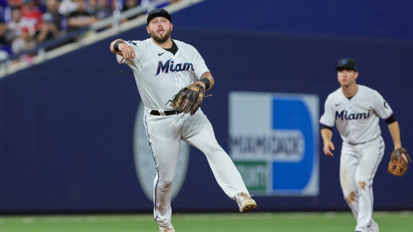 MIAMI, FLORIDA – AUGUST 2: Jake Burger #36 of the Miami Marlins throws the baseball to first baseman Josh Bell (not pictured) and retires Nick Castellanos (not pictured) of the Philadelphia Phillies during the fifth inning at loanDepot park on August 2, 2023 in Miami, Florida. (Photo by Sam Navarro/Getty Images)