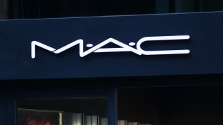 A logo sits above the entrance to a M.A.C Cosmetics Inc. store, operated by Estee Lauder Cos., in Dusseldorf, Germany, on Tuesday, Oct. 1, 2013. The Bundesbank said last month that German growth is still being supported by an “extraordinarily good” consumer climate, in part due to the labor market. Photographer: Krisztian Bocsi/Bloomberg via Getty Images